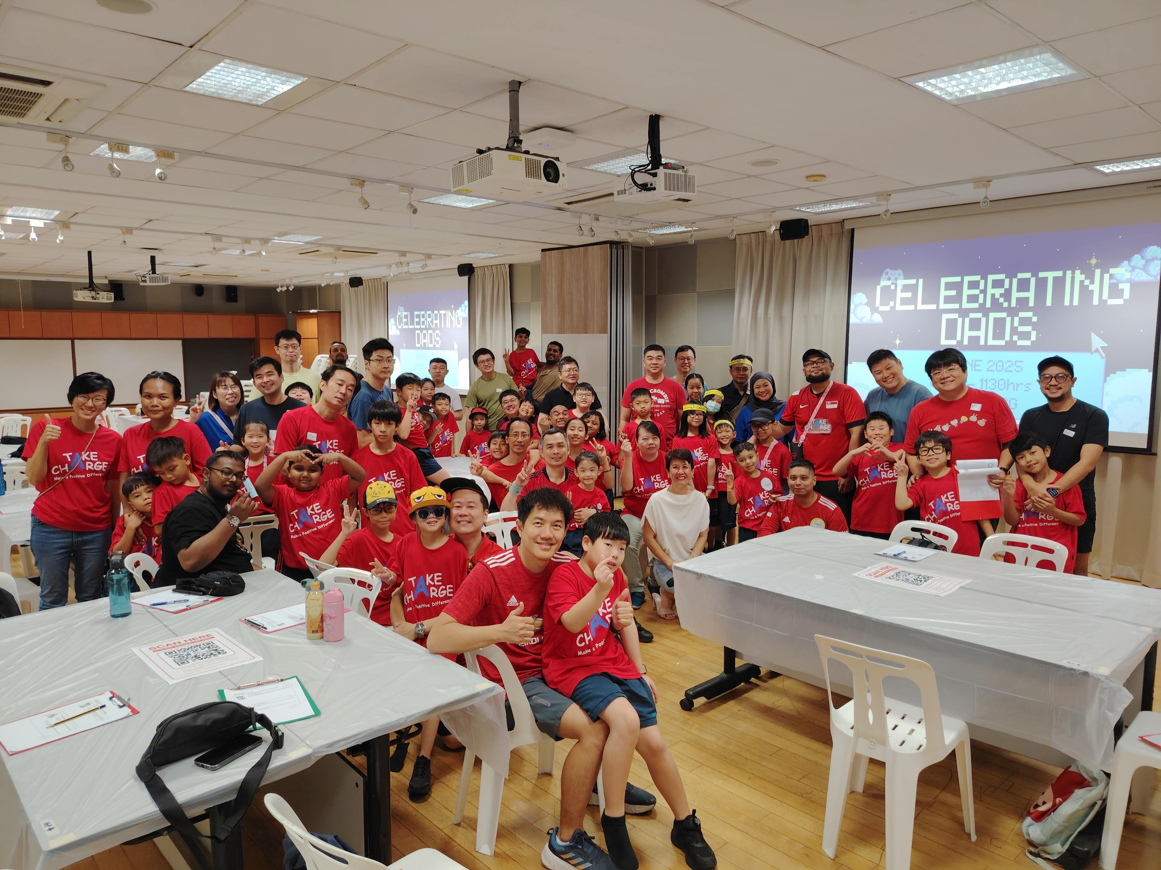 A group photo of staff, students and their fathers
